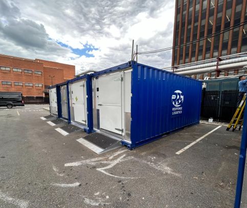 nterior of a mobile walk-in cooler with stainless steel shelving.