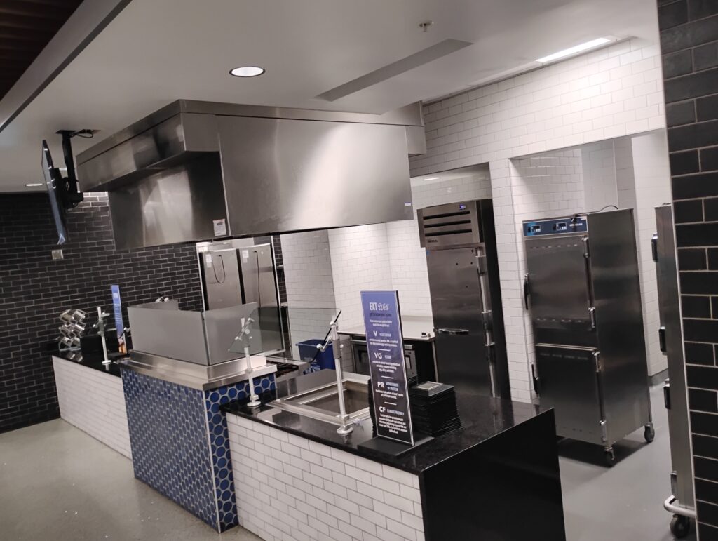 Commercial kitchen exhaust hood and stainless steel refrigeration units