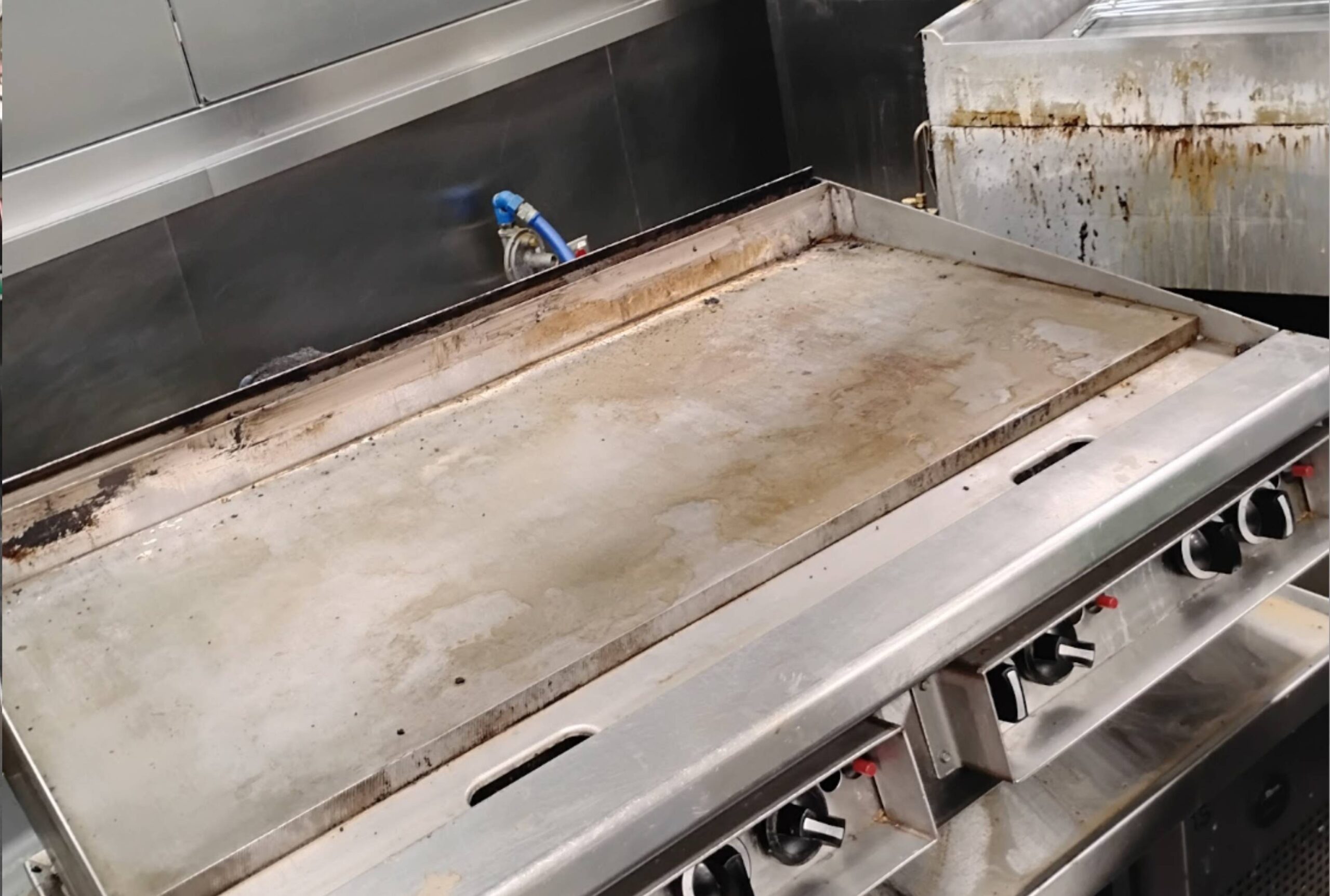 clean commercial kitchen cook top