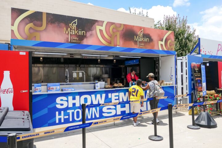 Branded container concession stand with guests ordering at the counter