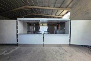 White container concession stand with the service window open